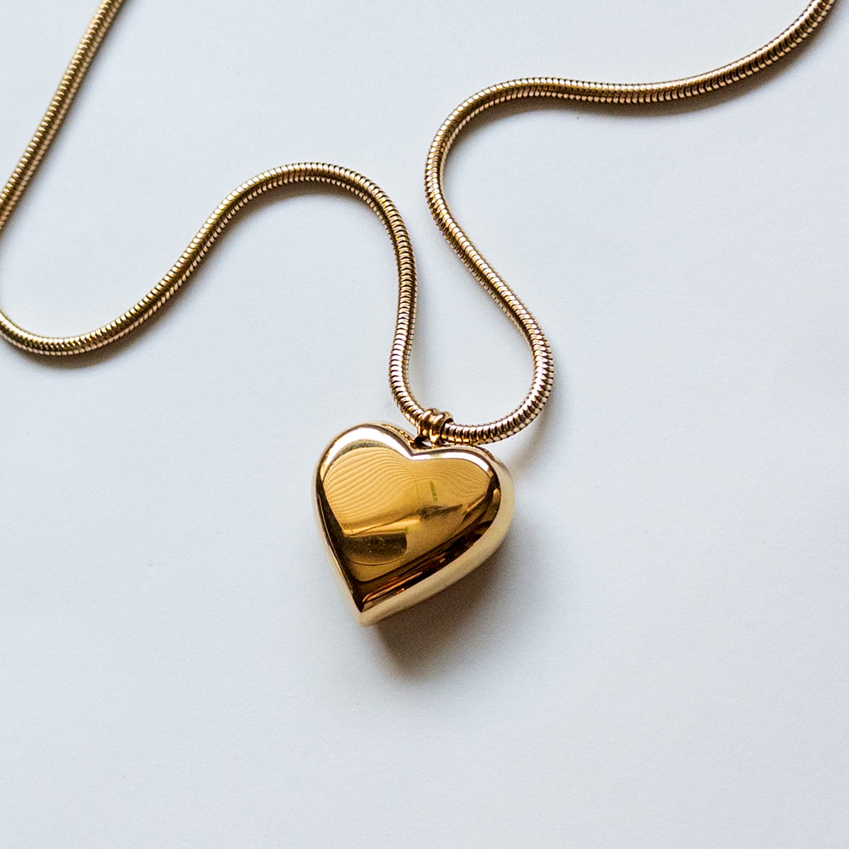 18k gold-plated stainless steel puffy heart pendant on a thick snake chain.