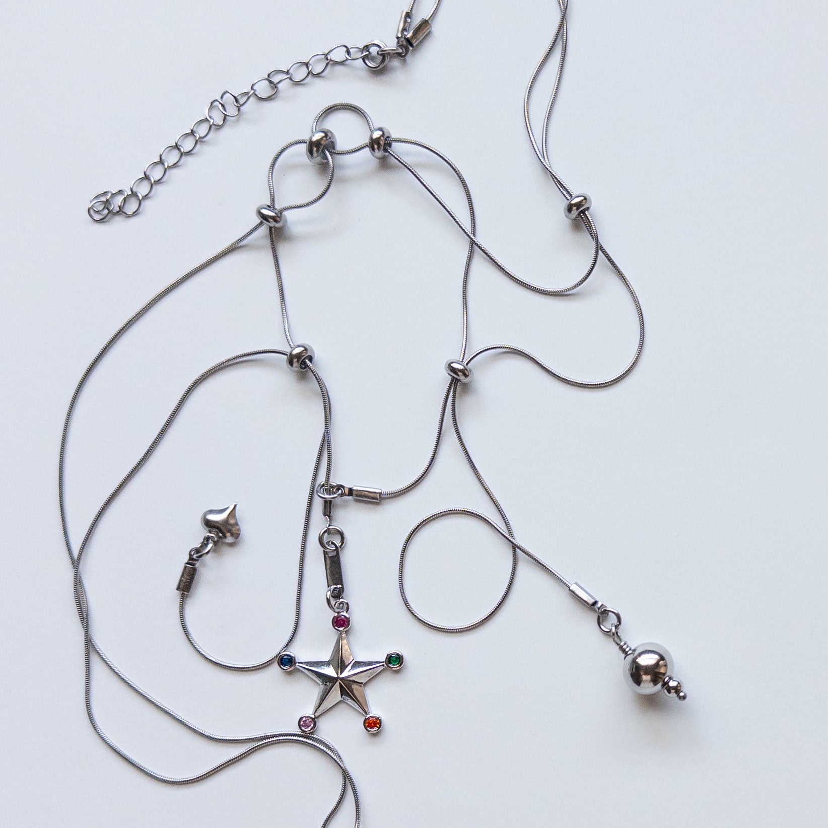 modular sliding necklace with assortment of charms