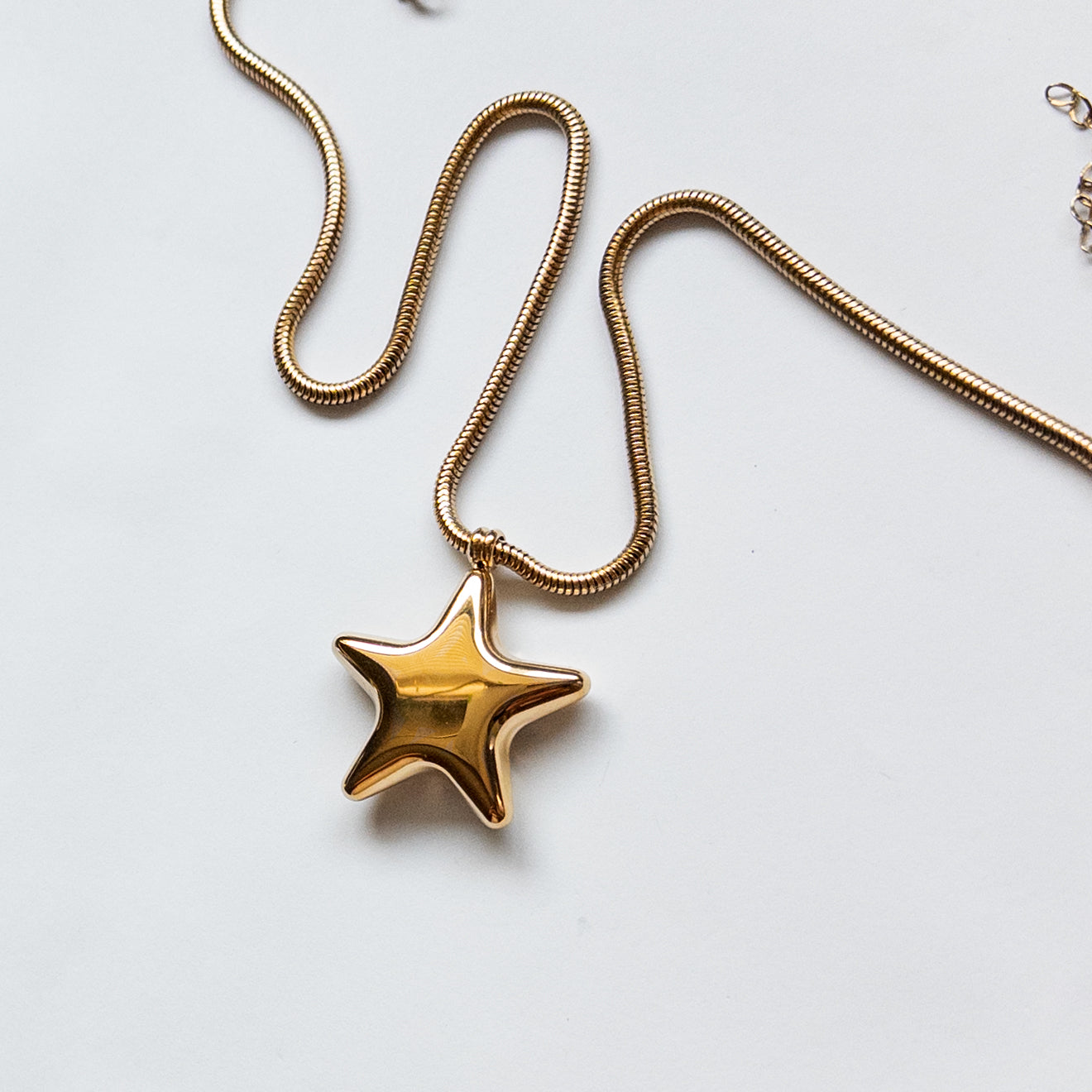 18k gold-plated stainless steel puffy star pendant on a thick snake chain necklace