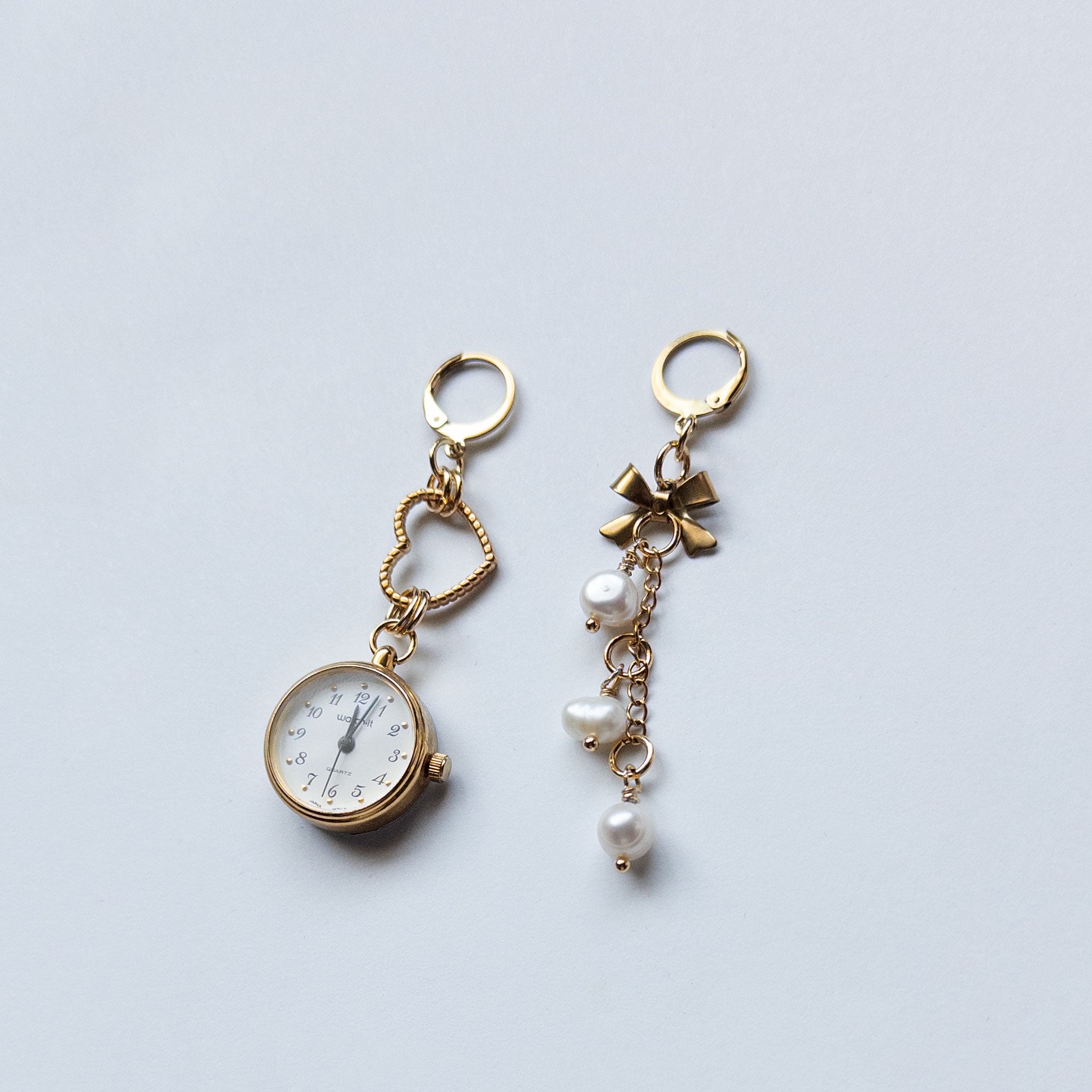 mixed metal earrings with vintage watch and star charms