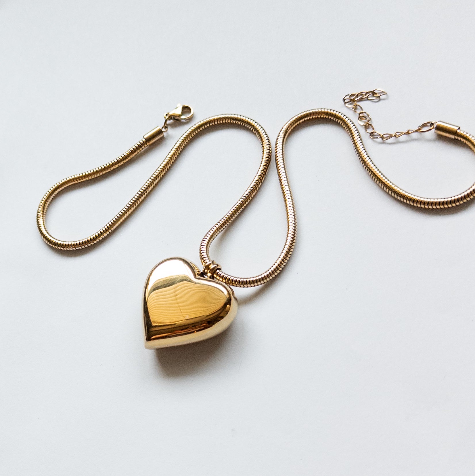 18k gold-plated stainless steel puffy heart pendant on a thick snake chain.