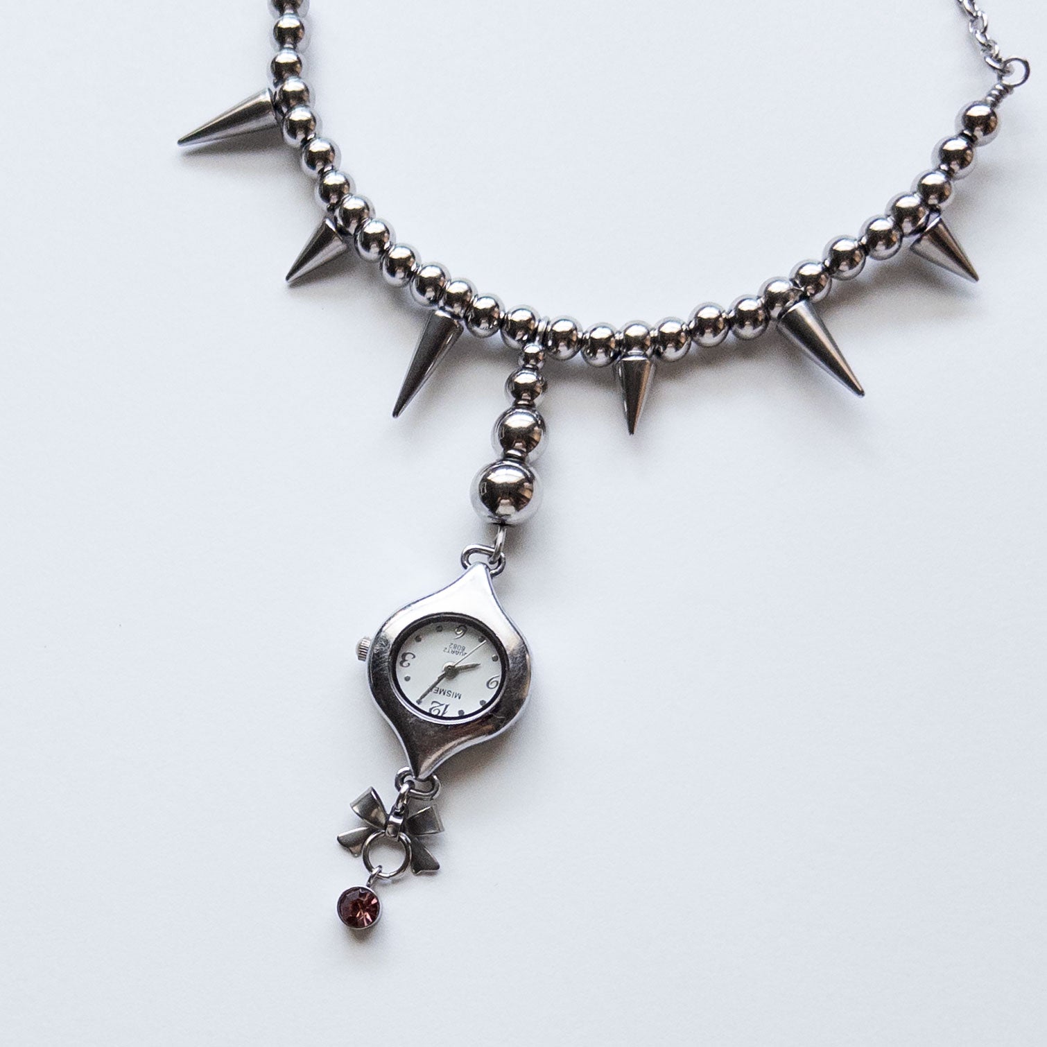 spiky necklace with watch pendant