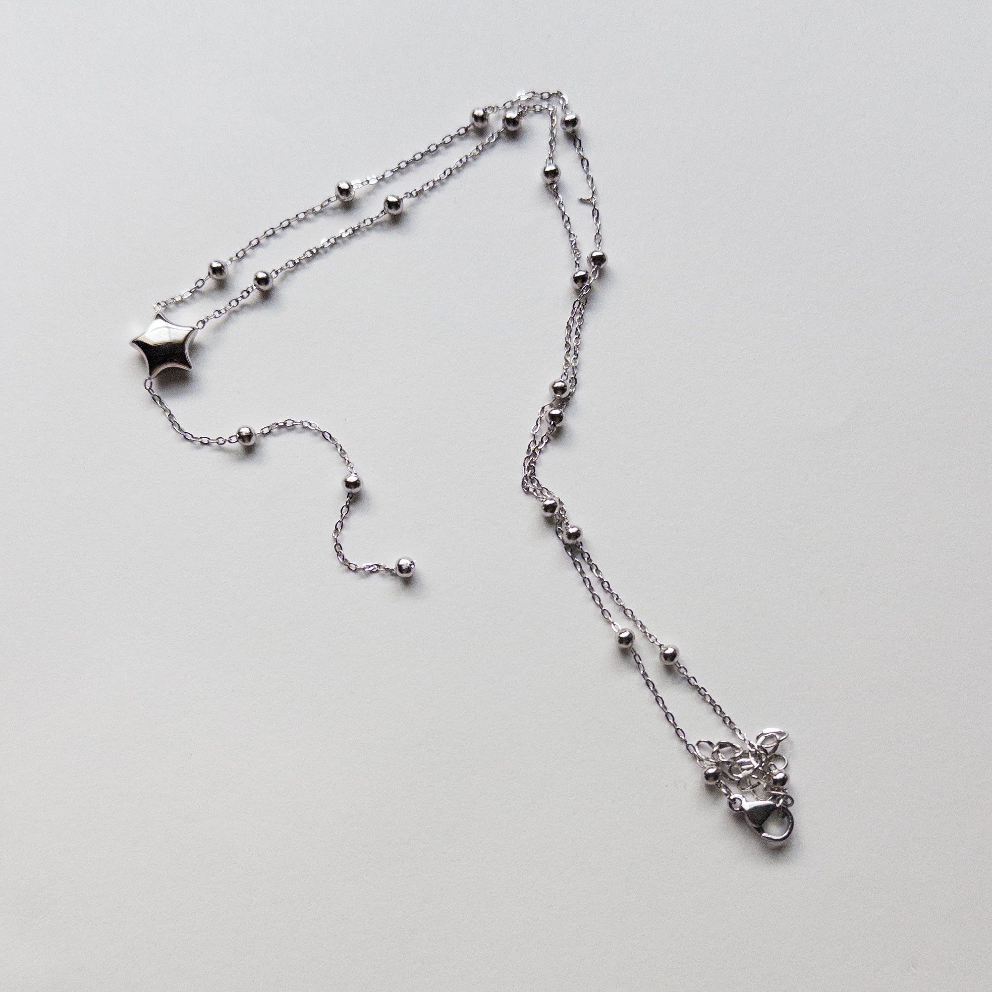 silver stainless steel puffy star lariat necklace dainty layering
