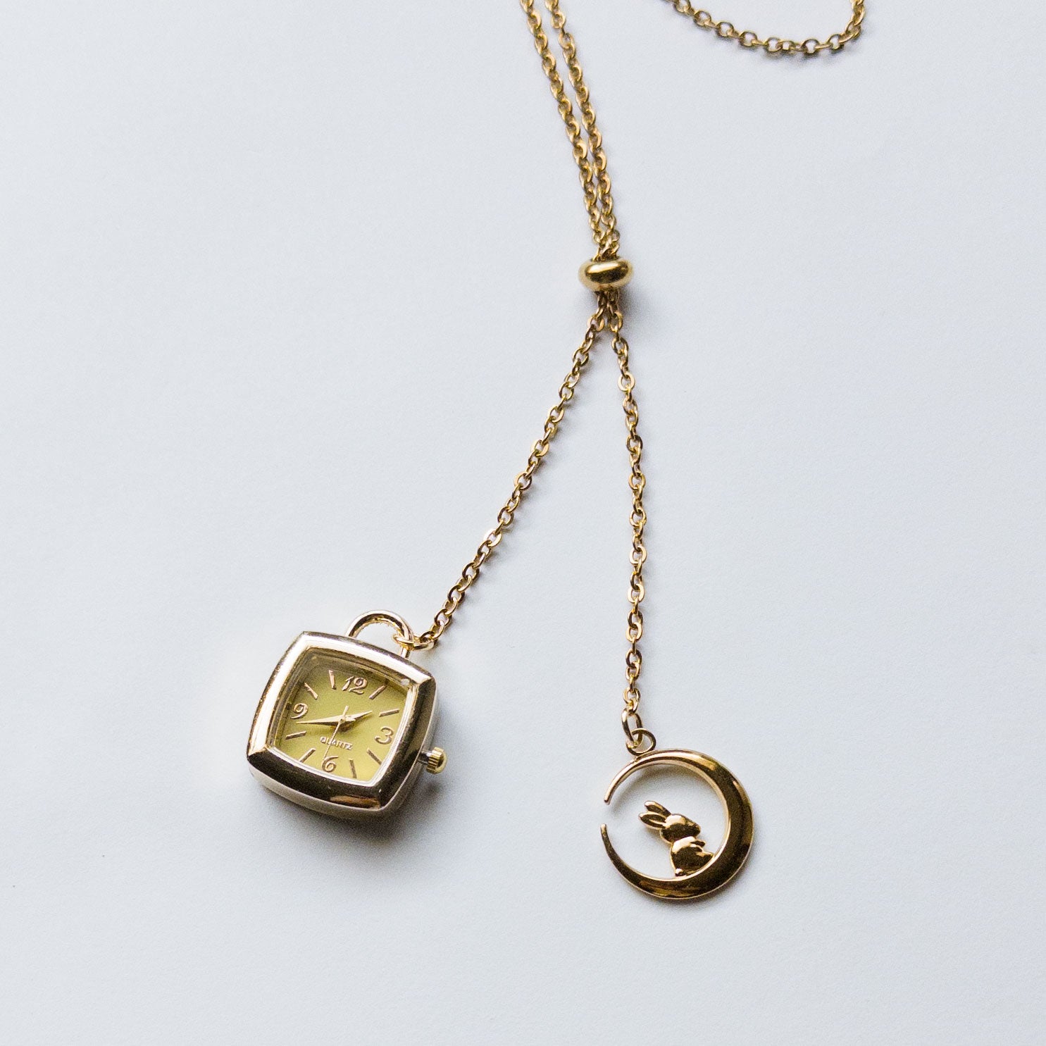 gold lariat sliding necklace with watch and moon charm