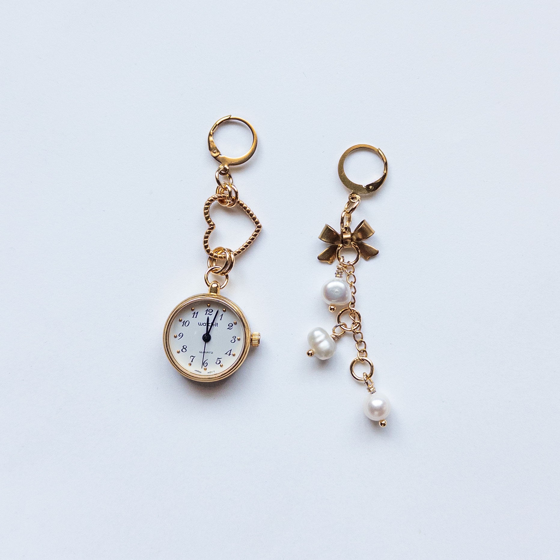 mismatched gold watch earrings