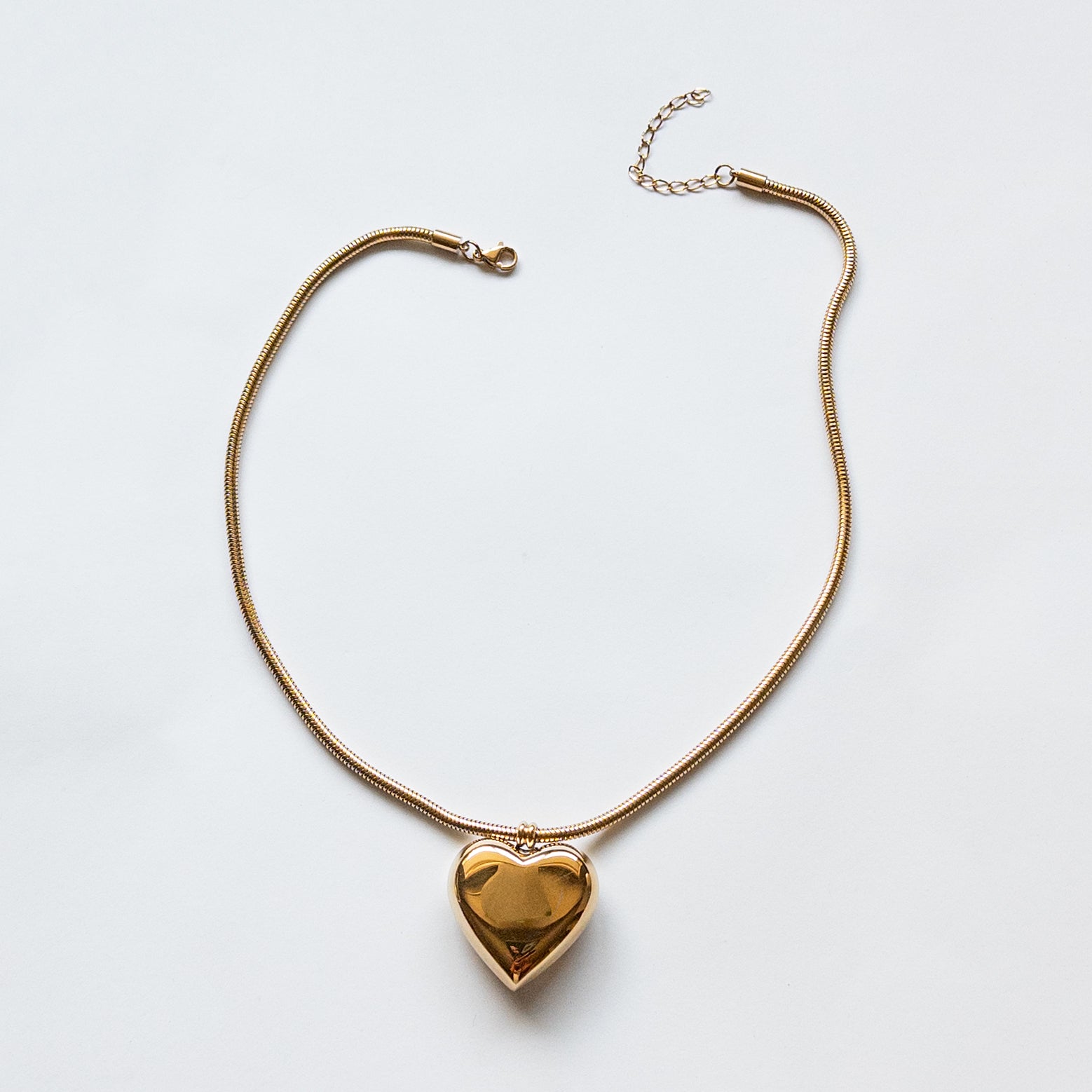 18k gold-plated stainless steel puffy heart pendant on a thick snake chain.