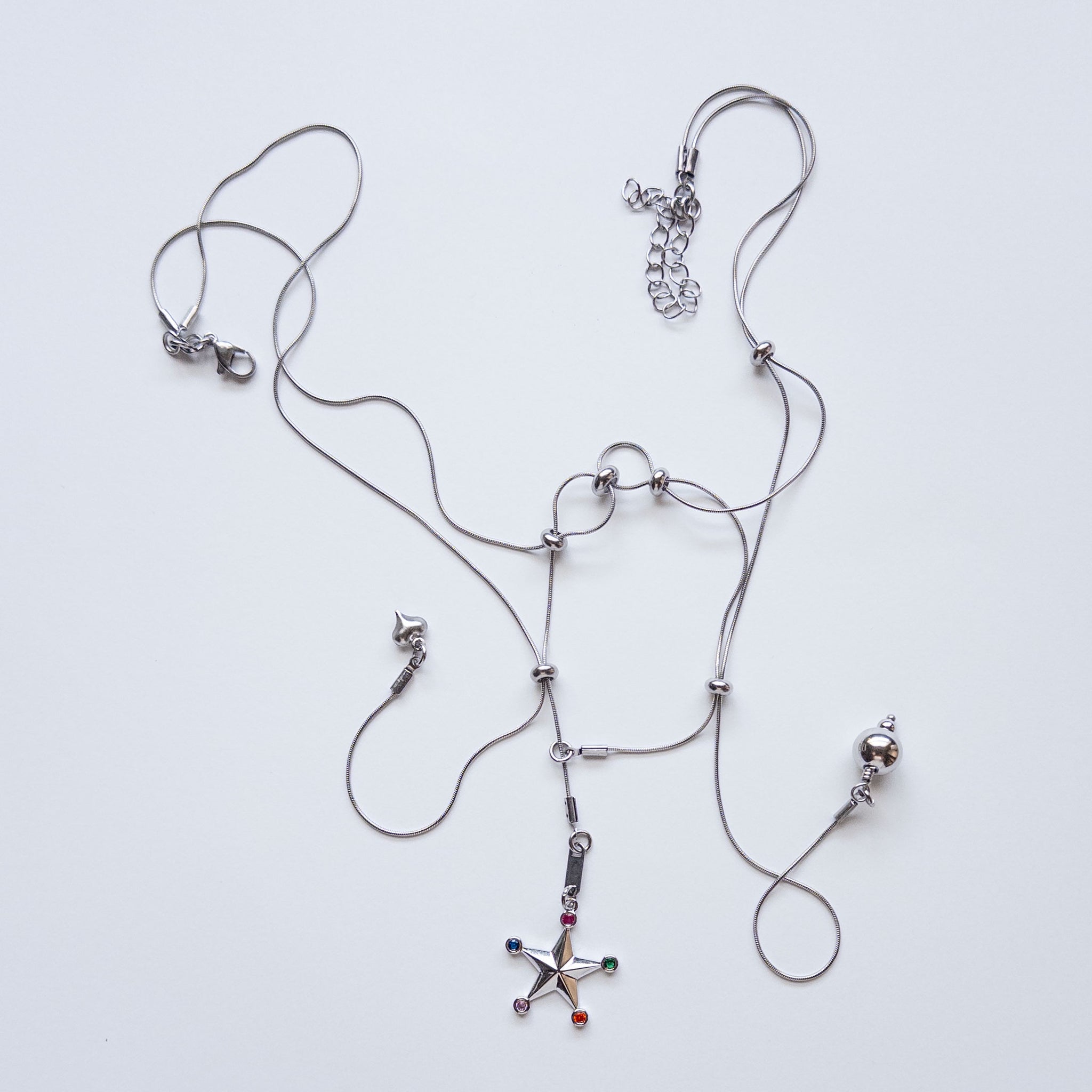 modular sliding necklace with assortment of charms