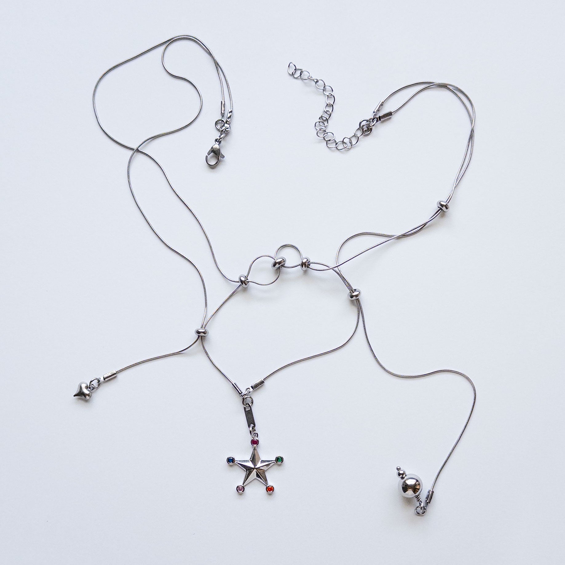 modular sliding necklace with assortment of charms