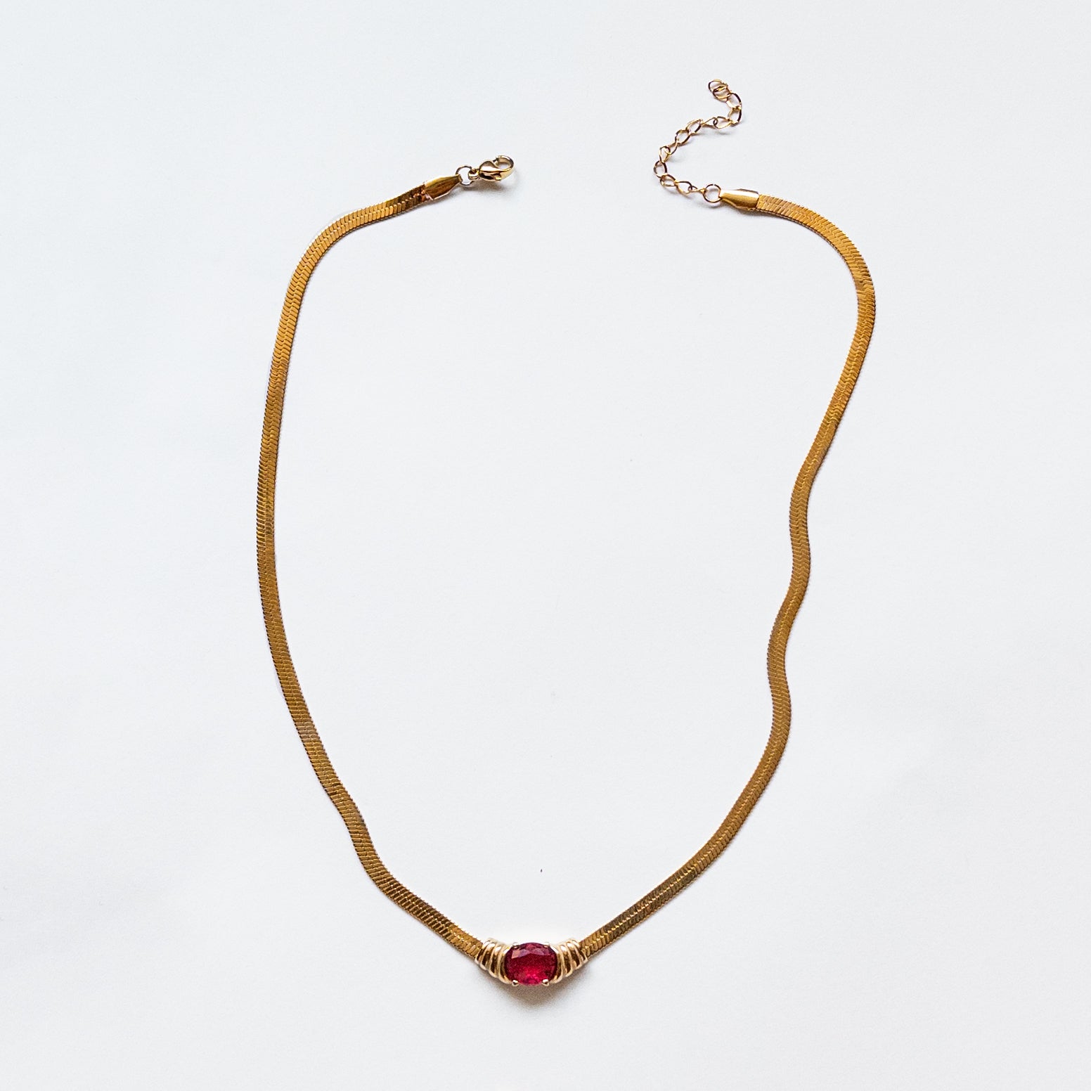 snake chain with red cubic zirconia gem