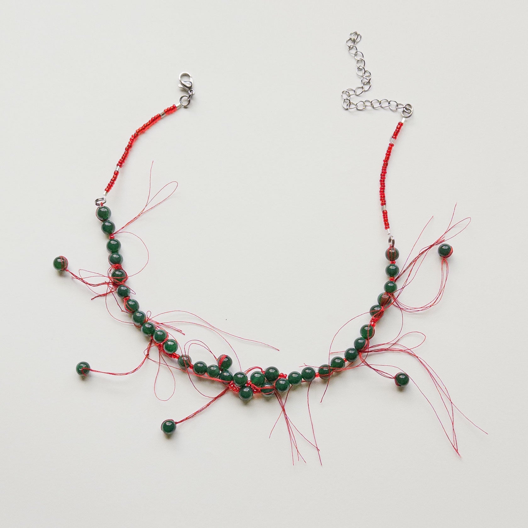 green jade beaded necklace red threads lucky charm talisman