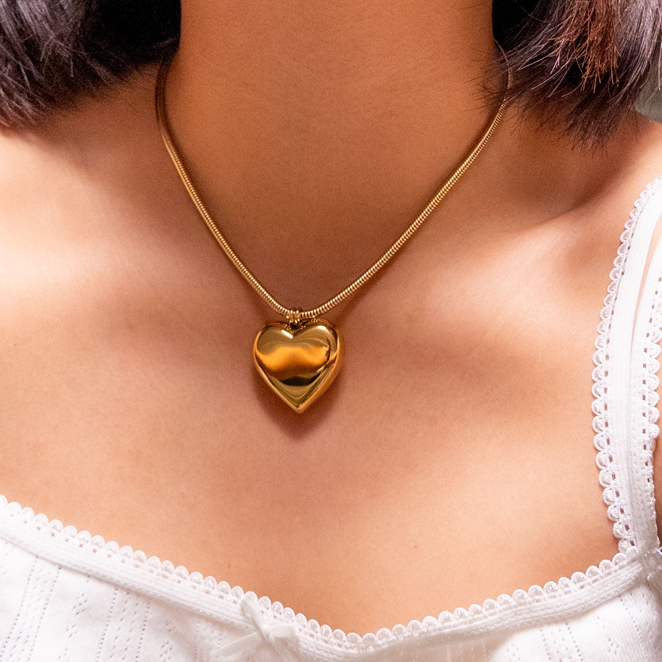 18k gold-plated stainless steel puffy heart pendant on a thick snake chain.