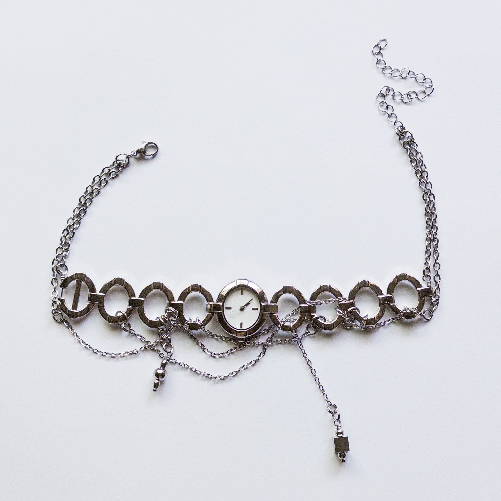 upcycled vintage watch choker necklace with dangling silver charms stainless steel