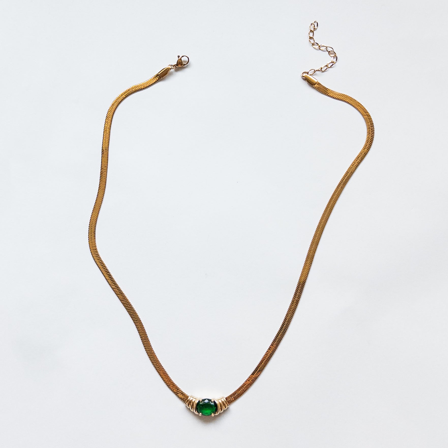 snake chain with green cubic zirconia gem